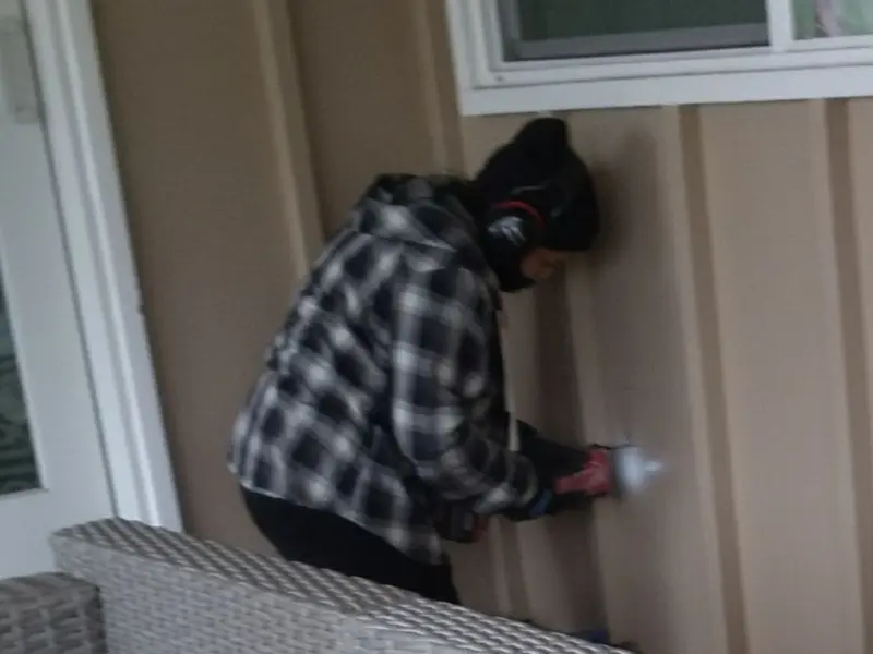 Professional electrician installing an exterior outlet in Severance